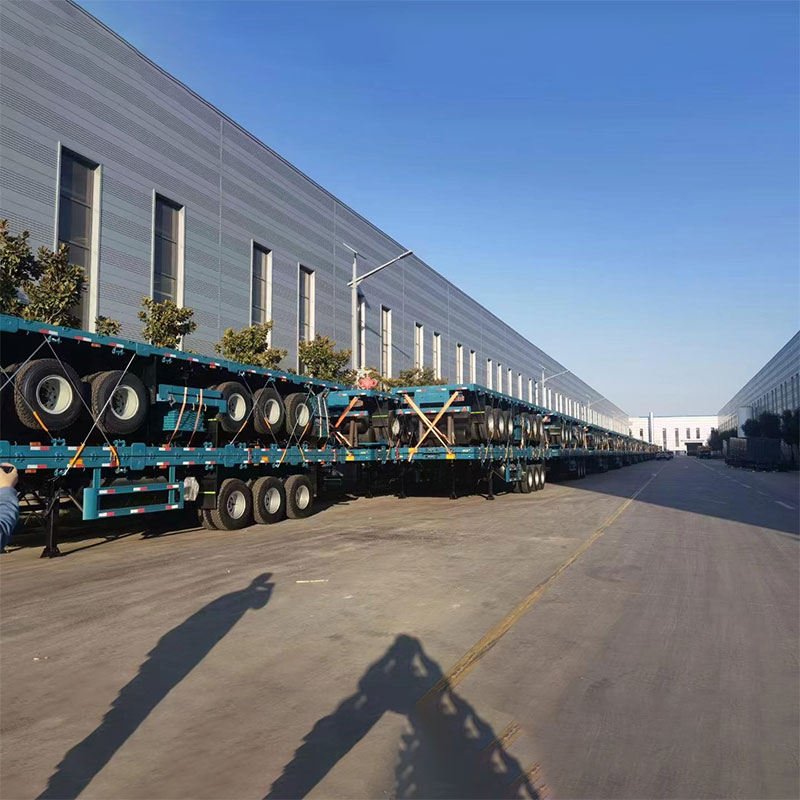 ຂະຫນາດໃຫຍ່ຂະຫນາດ 40ft 3 Axles Flatbed Semi Cocks ທີ່ມີ 12 ກະແຈ ຂະຫນາດໃຫຍ່ຂະຫນາດ 40ft 3 Axles Flatbed Semi Cocks ທີ່ມີ 12 ກະແຈ